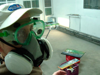 varnishing wearing a NIOSH mask